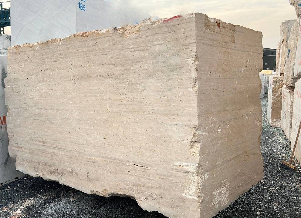 A picture of Cream ravertine block in the stock