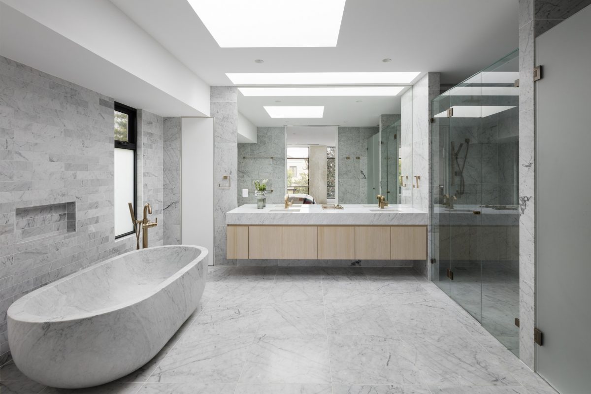 A picture of a bathroom design with crystalline marble natural stone flooring