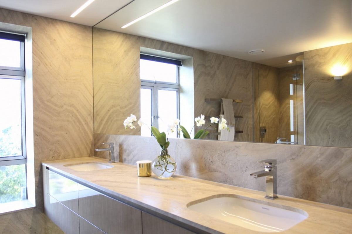 A picture of a bathroom design with crystalline marble natural stone walling